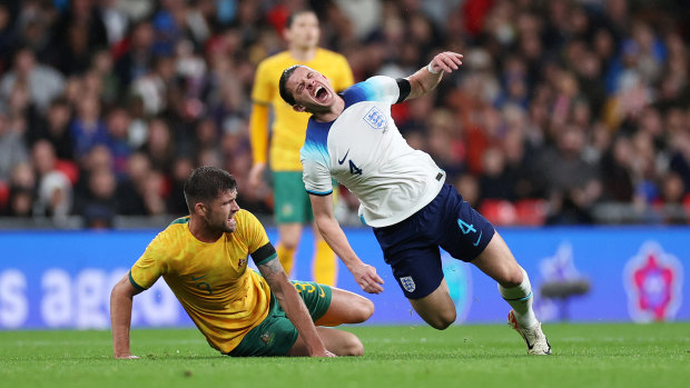 Australia’s Cameron Burgess brings down Conor Gallagher.