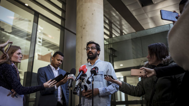  Aran Mylvaganam from the Tamil Refugee Council speaks to the media outside the Federal Court on Saturday.