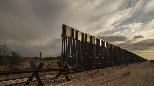 The US-Mexico border fence under construction near the Santa Teresa border crossing in El Paso, Texas, in June.