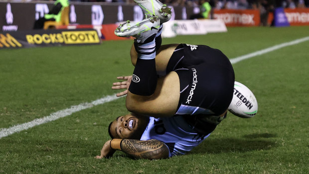 Cronulla centre Siosifa Talakai scores one of his two first-half tries against Manly.