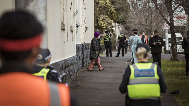 Residents of Hambleton House, Albert Park are picked up by Ambulance staff and moved.