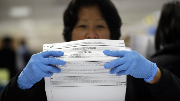 A mail-in ballot is examined at the Santa Clara County Registrar of Voters in San Jose, California.