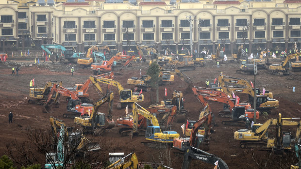 Builders race to finish the new Wuhan field hospital by the February 3 deadline.
