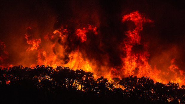 Large flames are seen on a hillside outside the village of Monchique, in southern Portugal's Algarve region, on Sunday.