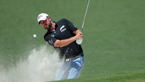 Marc Leishman plays out of the bunker in his final round.