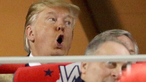 Trump reacts during the game.