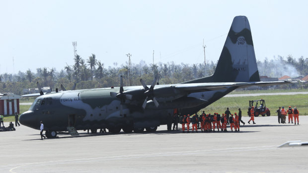 Members of the Brazilian emergency response team arrive at Beira International airport in Mozambique. 
