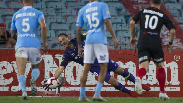 Unbeatable: Eugene Galekovic saves a penalty  from Oriol Riera.