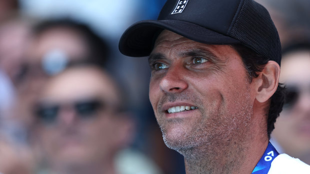 Mark Philippoussis watches Stefanos Tsitsipas in action.