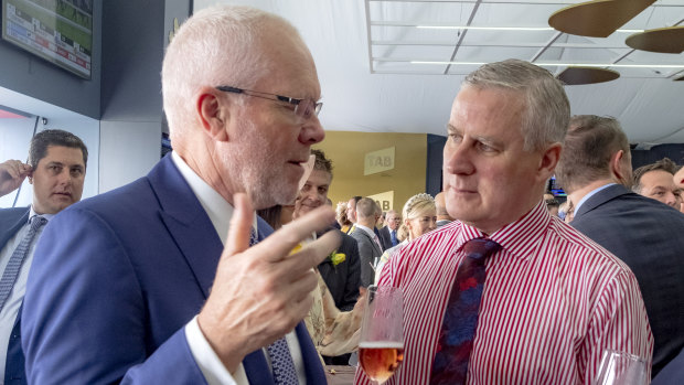 Former ABC chairman Justin Milne and Deputy Prime Minister Michael McCormack chat at the Tabcorp marquee.