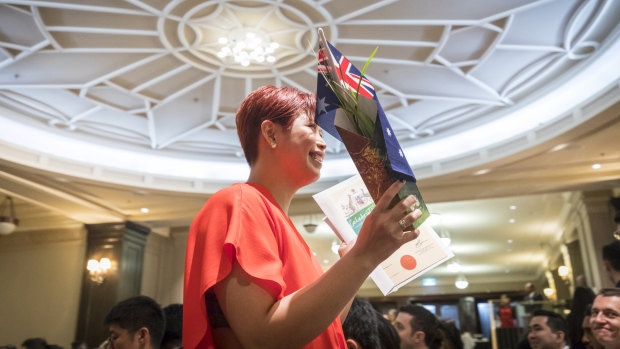 Three hundred new Australians received their citizenship at an Australia Day ceremony at Melbourne Town Hall.