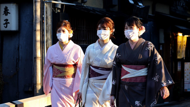 Japanese women wearing face masks in Kyoto.