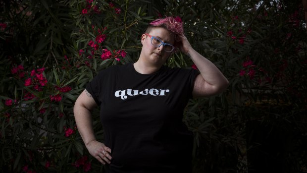 Jordi Kerr, who identifies as non-binary, is being employed as a peer navigator to help connect LGBTQIA+ people with health services.