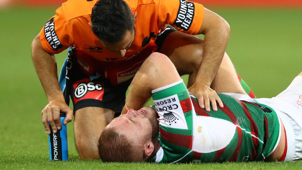 Tom Burgess went down late during South Sydney’s 26-18 loss to Melbourne.