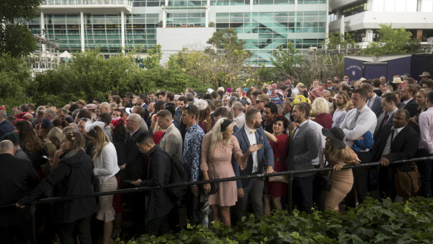 Racegoers faced massive lines at Flemington Station as they made their way from the Melbourne Cup.