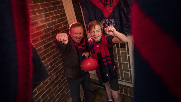 Diehard Melbourne Demons supporters Stephen and James Le Get can’t wait for their team to play in the grand final. 