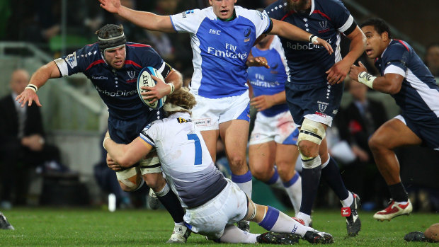 Former Rebels and England flanker Michael Lipman, tackled here by a Force player, was forced to retire early due to the effects of repeated concussions.