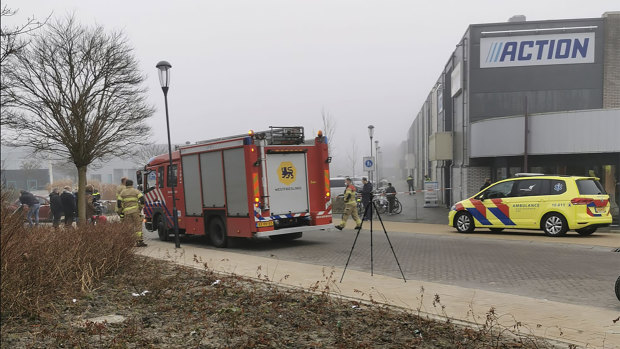 Emergency services attend the scene close to a coronavirus test station north of Amsterdam after a homemade firework was detonated.