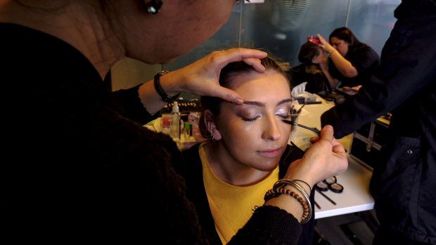 A model has their make-up applied backstage at Access to Fashion. 