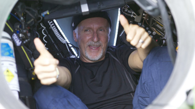 James Cameron gives two thumbs-up as he emerges from the Deepsea Challenger submersible in 2012 after his successful solo dive in the Mariana Trench. 
