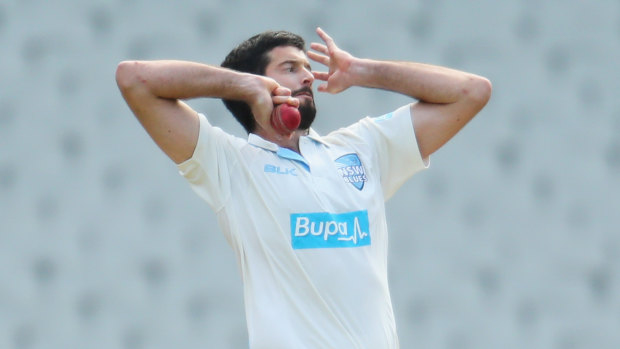 Somerville rolling the arm over for NSW during a Sheffield Shield match in 2014. 