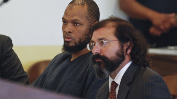 Siraj Ibn Wahhaj, left, sits next to public defense attorney Aleks Kostich at a first appearance in New Mexico state district court in Taos, NM.
