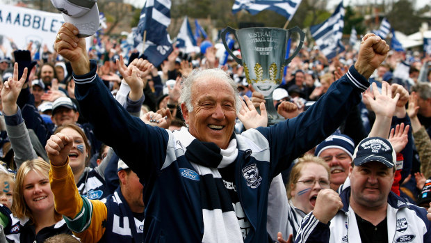 Frank Costa celebrates with fans after the Cats’ grand final win in 2009.