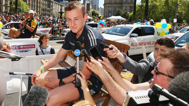 Former Hawk Billy Hartung speaks during the 2015 grand final parade, having been dropped from Hawthorn's team.