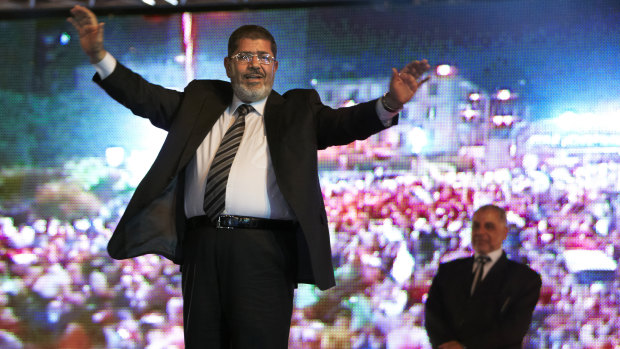 Then Muslim Brotherhood's presidential candidate Mohammed Morsi holds a rally in Cairo, Egypt, in 2012. He won the election a month later.