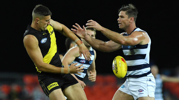 Tough contest: Richmand ruckman Ivan Soldo takes on Geelong big man Tom Hawkins at Metricon Stadium.