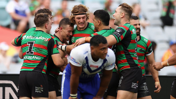 Damien Cook and the Rabbitohs celebrate a Good Friday try.