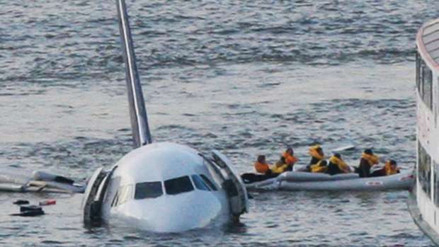 Passengers escape US Airways flight 1549 after Captain Chesley Sullenberger was able to safely land it in the Hudson River. 
