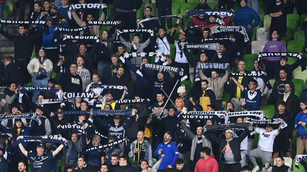 Melbourne Victory fans cheer on the Wellington Phoenix against Melbourne City.