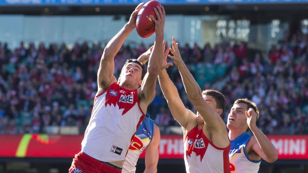 High praise: Heeney calls Tom McCartin (left) one the most courageous players he's seen.