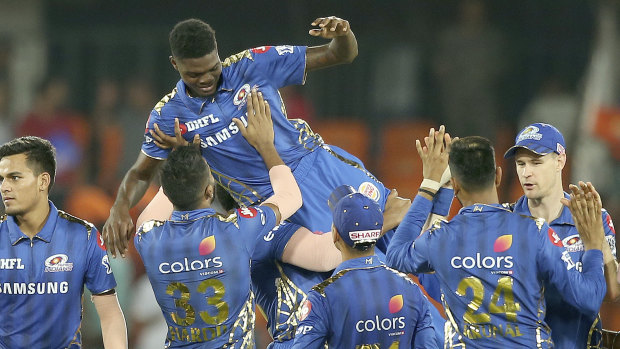 Alzarri Joseph is lifted by his Mumbai teammates after his record-breaking IPL performance.
