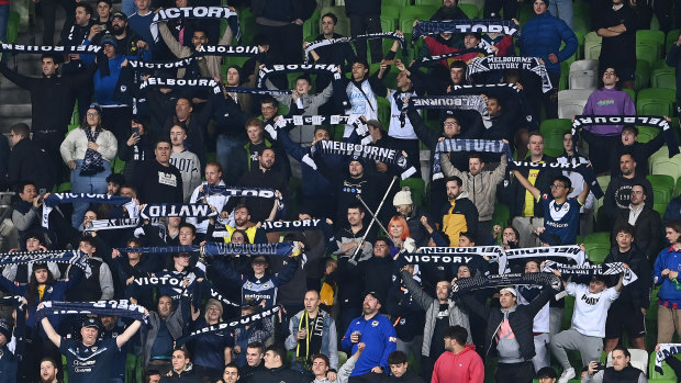 Melbourne Victory fans cheer on the Wellington Phoenix against Melbourne City.