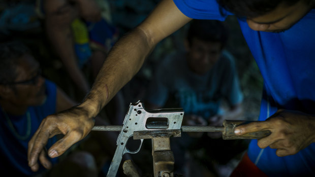 A gunsmith near Danao, where illegal gun making has provided a livelihood for generations in a remote, poor area of the Philippines. 