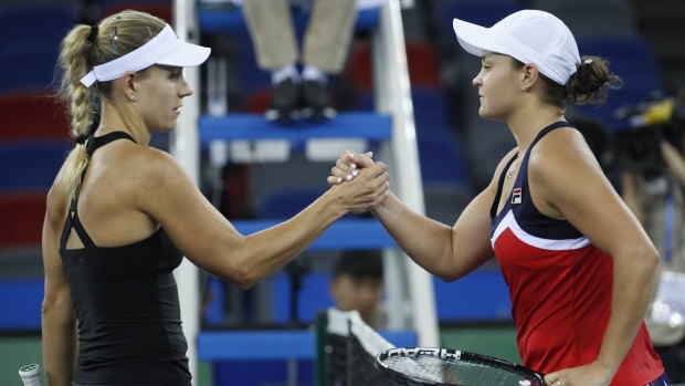 Ashleigh Barty shakes hands with Angelique Kerber after defeating the German.