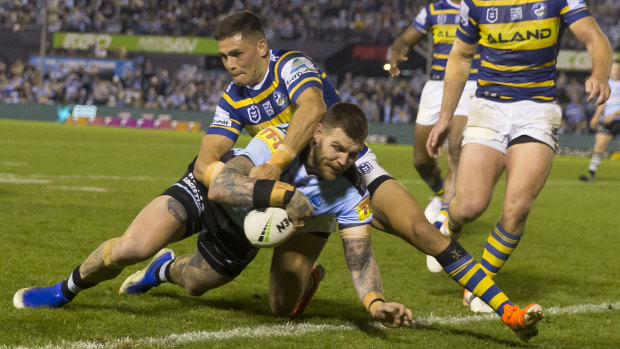 Shire thing: Josh Dugan adds to the Eels' misery with another try.