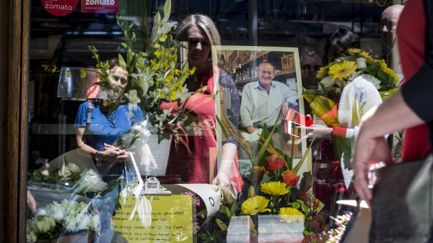 Mourners pay their respects to the co-owner of Pellegrini's Sisto Malaspina after he was stabbed in the Bourke Street incident on Friday. 
