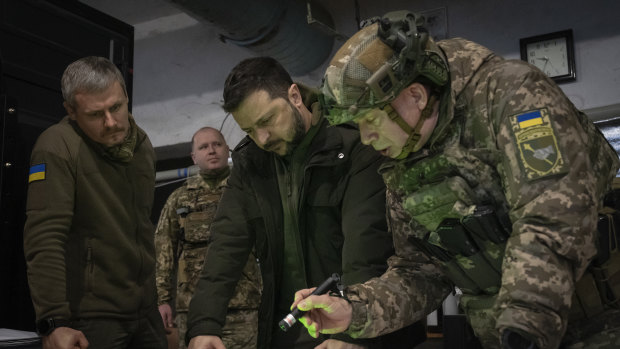 Ukrainian President Volodymyr Zelensky, centre, with Colonel General Oleksandr Syrskyi, right, in November last year.