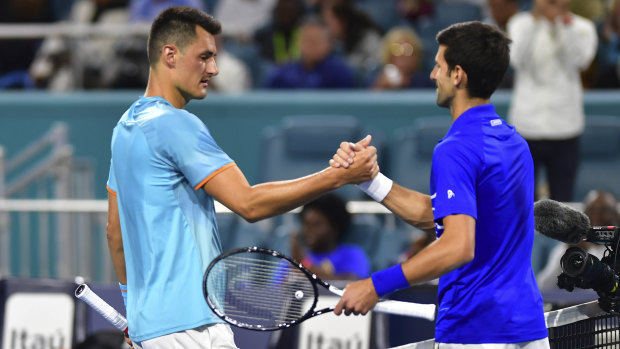 Bernard Tomic congratulates Novak Djokovic after their match in Miami.