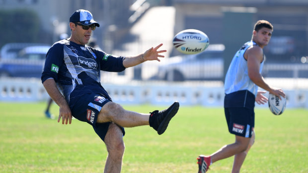 Making the grade: Nathan Cleary (right) with coach Brad Fittler at NSW training.
