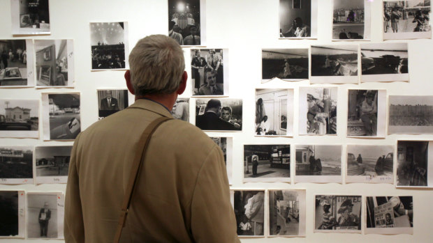 A man looks at Robert Frank prints at "The Americans" exhibit at the Museum of Modern Art in San Francisco in 2009.