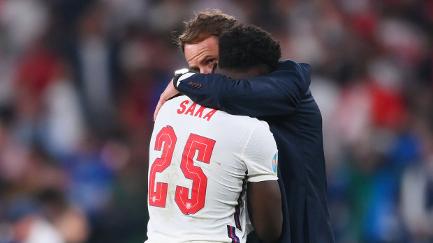 England manager Gareth Southgate consoles Bukayo Saka after the defeat to Italy.
