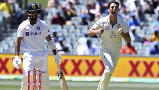 Australia's Pat Cummins celebrates the wicket of India's Cheteshwar Pujara on the third day of their test at the Adelaide Oval on Saturday.