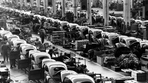 Beetles are assembled in lines at the Volkwagen plan in Wolfsburg, West Germany, in 1964.