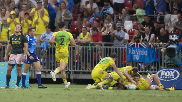 Great escape: Australia celebrate after full-time against South Africa.