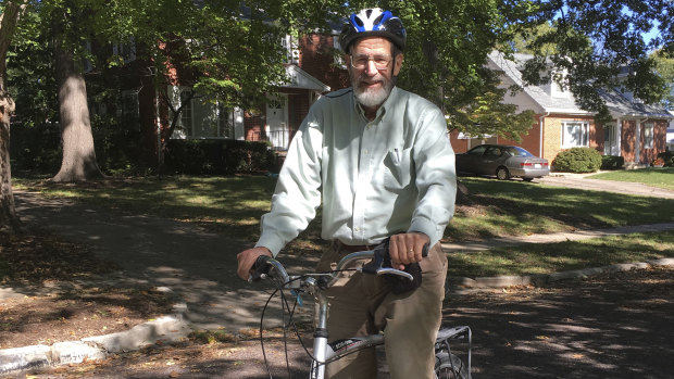 George Smith, professor emeritus at the University of Missouri who won the 2018 Nobel Prize for chemistry rides his bike on a biking/walking trail in Columbia.