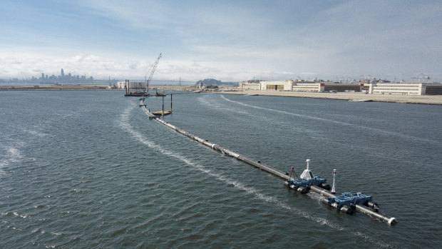 The Ocean Cleanup, a floating boom to corral plastic litter in the Pacific Ocean, is assembled in Alameda, California.